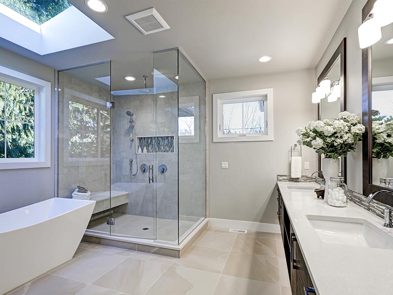 Spacious bathroom in gray tones with heated floors